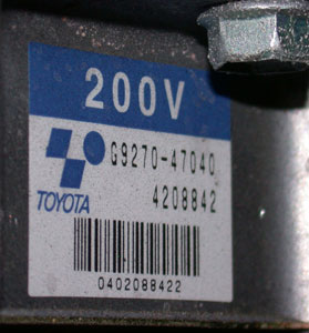Photo 6: Note that the label on the inverter/converter of this Prius rates the high-voltage system at 200 volts, which is more than enough to kill you instantly. 