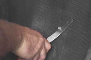 using a flexible knife, cut the plug on the inside of the tire 1/8-inch above the innerliner. be careful not to stretch the plug when cutting.