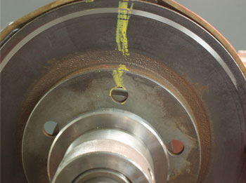 The score mark from the off-car break lathe should roughly correspond with the index mark when rotor runout was measured on the vehicle.