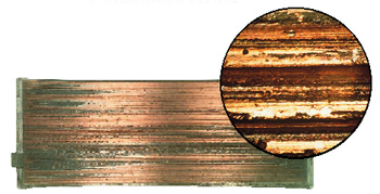 figure 1: overplated copper alloy bearing gouged by cast iron debris. inset photo shows the microscopic detail of the gouges.  (courtesy of federal-mogul)