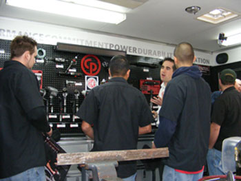 Waubonsee Community College students check out tool products and equipment in the Chicago Pneumatic mobile tool trailer. The school was awarded $7,000 worth of Chicago Pneumatic tools and other items commemorating their winning the inaugural T2 School of Year Award. 
