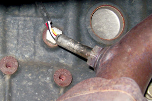 photo 8: the block drain is under the exhaust manifold (behind the o2 sensor).