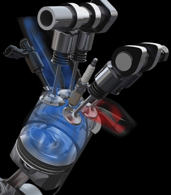 ford's ecoboost engine in action: the fuel injectors are mounted at the side of the combustion chamber. the spark plug is at the top of the chamber.