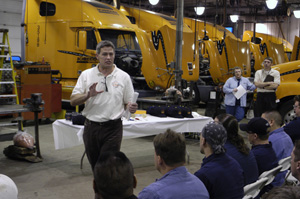 Tom Culver speaks to a group of fleet technicians at the company's green Bay, WI operating center/company-owned truck stop.