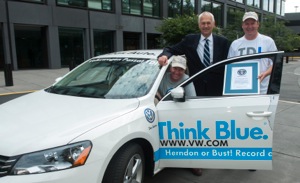President and CEO of Volkswagen Group of America Jon Browning, center, poses with Bob Winger, and Wayne Gerdes, right, following a Guinness World Record certificate presentation on Monday, June 24, 2013 at Volkswagen Group of America.
