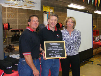 Waubonsee Community College automotive course instructors Ken Kunz and Jim Armitage receive the inaugural T2 School of Year Award from Beth Skove, associate publisher of Tomorrow’s Technician magazine. 