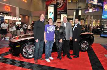 Ernest Feist (left) placed the winning bid for the third production model 2010 Hurst Camaro. Feist is flanked by his son, Ernie Jr., Linda Vaughn, SEMA Chair-Elect Scooter Brothers, and SEMA Vice President of Councils and Membership Nathan Ridnouer.